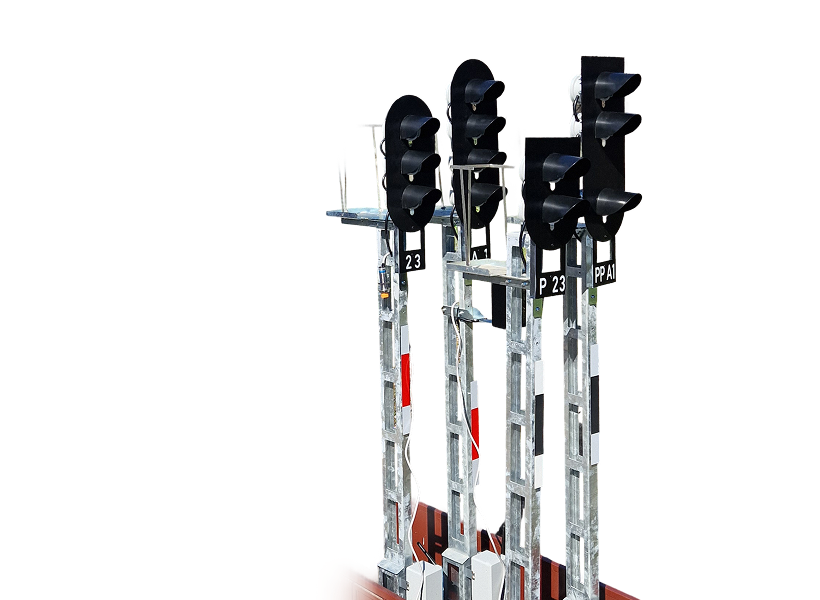 Three railway signal lights with black indicators