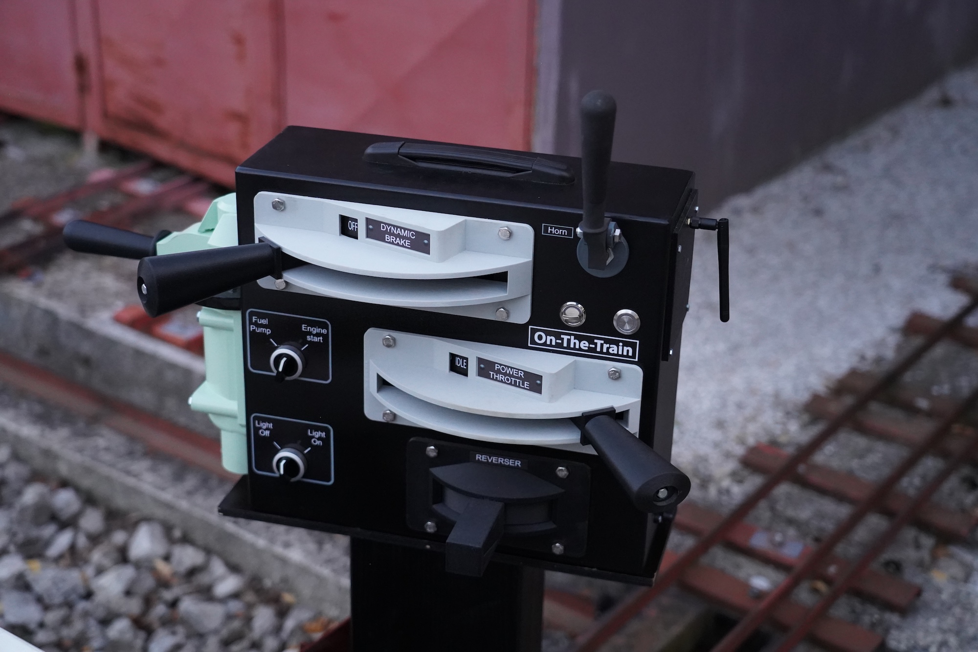 Black and white control panel with levers and dials